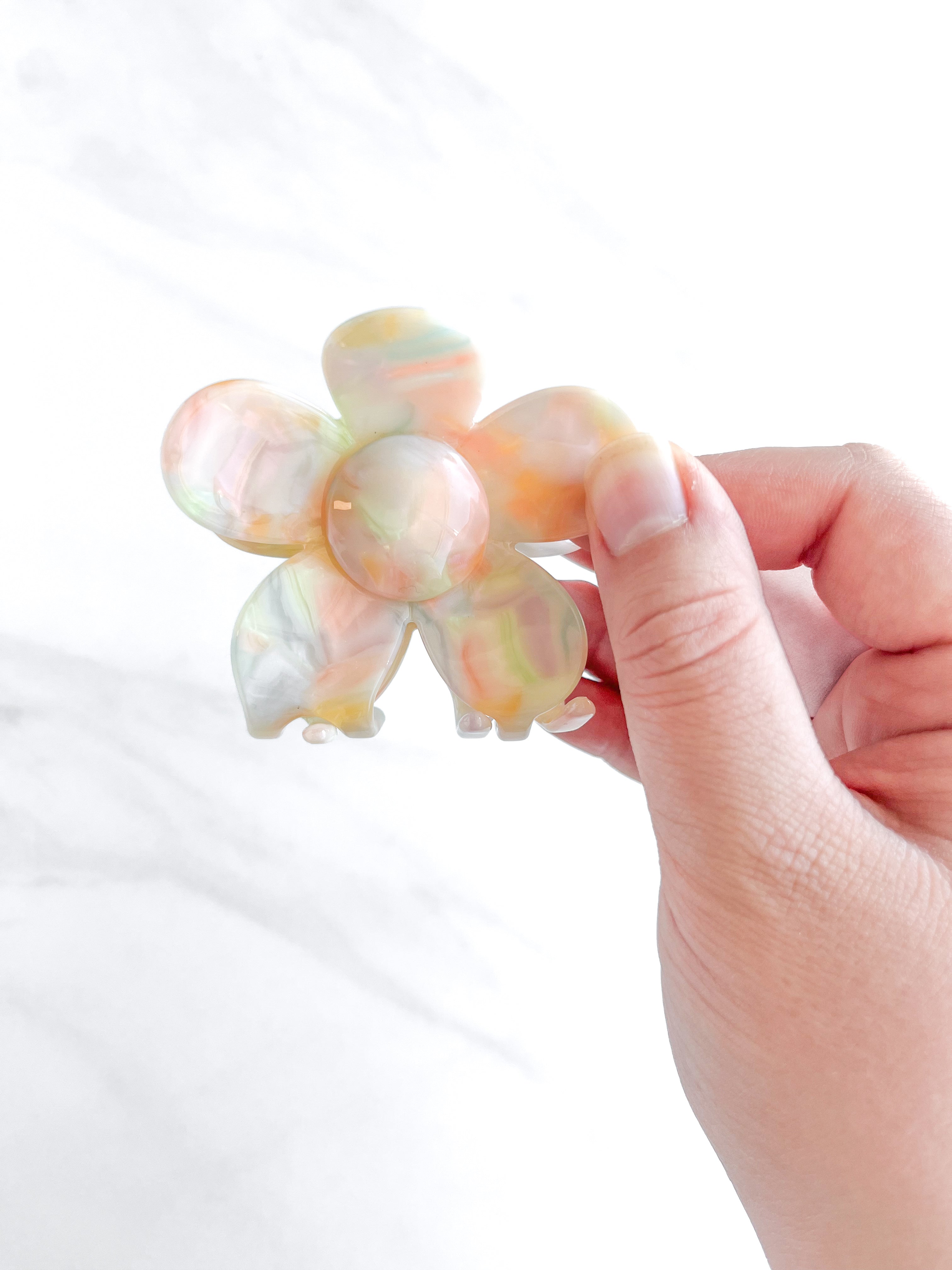 Hair claw clip in pink, yellow, or green marble in a flower shape