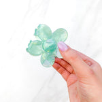 Hair claw clip in pink, yellow, or green marble in a flower shape
