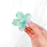 Hair claw clip in pink, yellow, or green marble in a flower shape