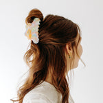 A woman with long hair styled perfectly with the On Cloud 9 Lilac Clip, showing both fashion and functionality.