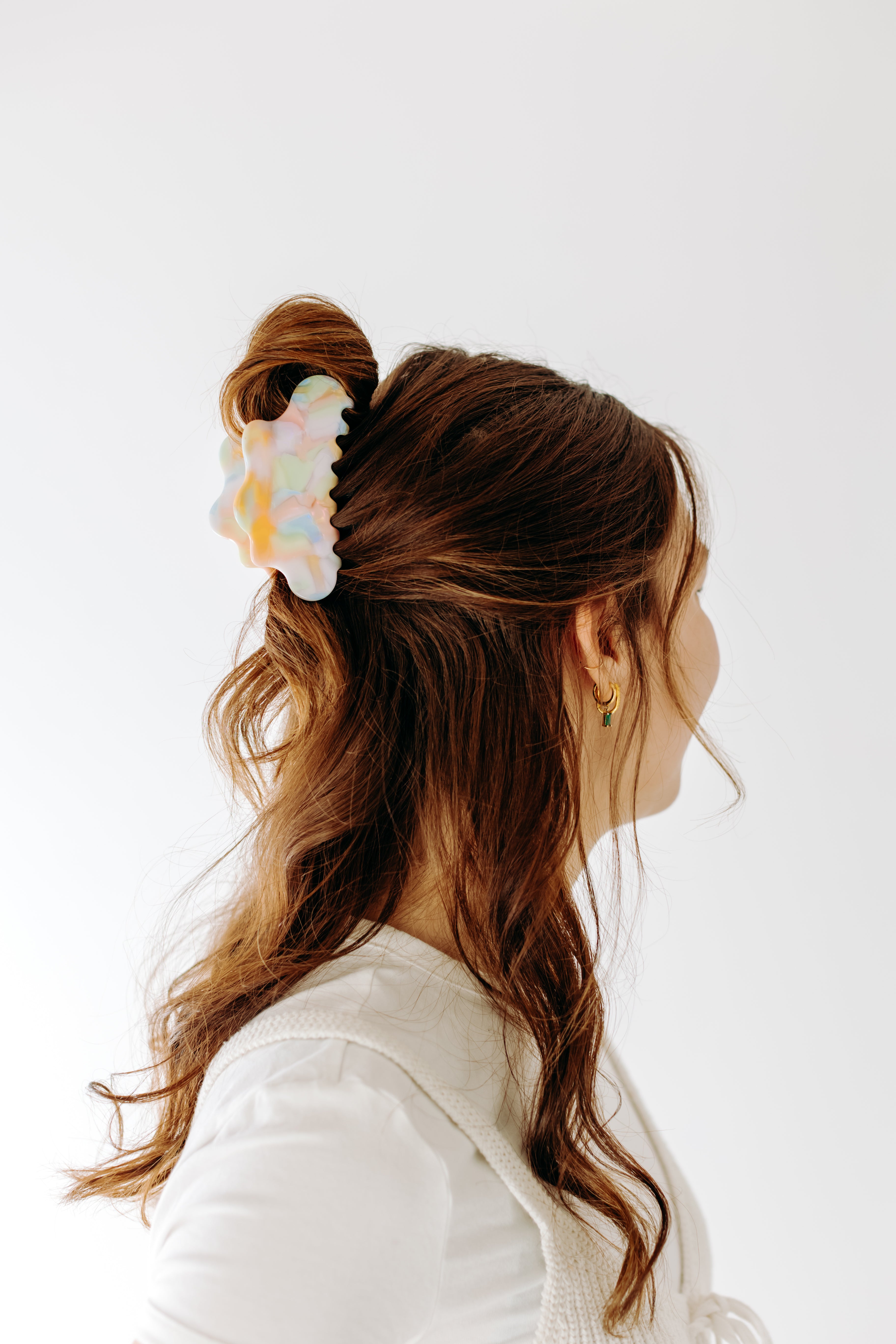 A woman with long hair styled perfectly with the On Cloud 9 Lilac Clip, showing both fashion and functionality.