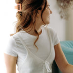 A woman with long hair styled perfectly with the Spring Fling Lilac Clip, showing both fashion and functionality.