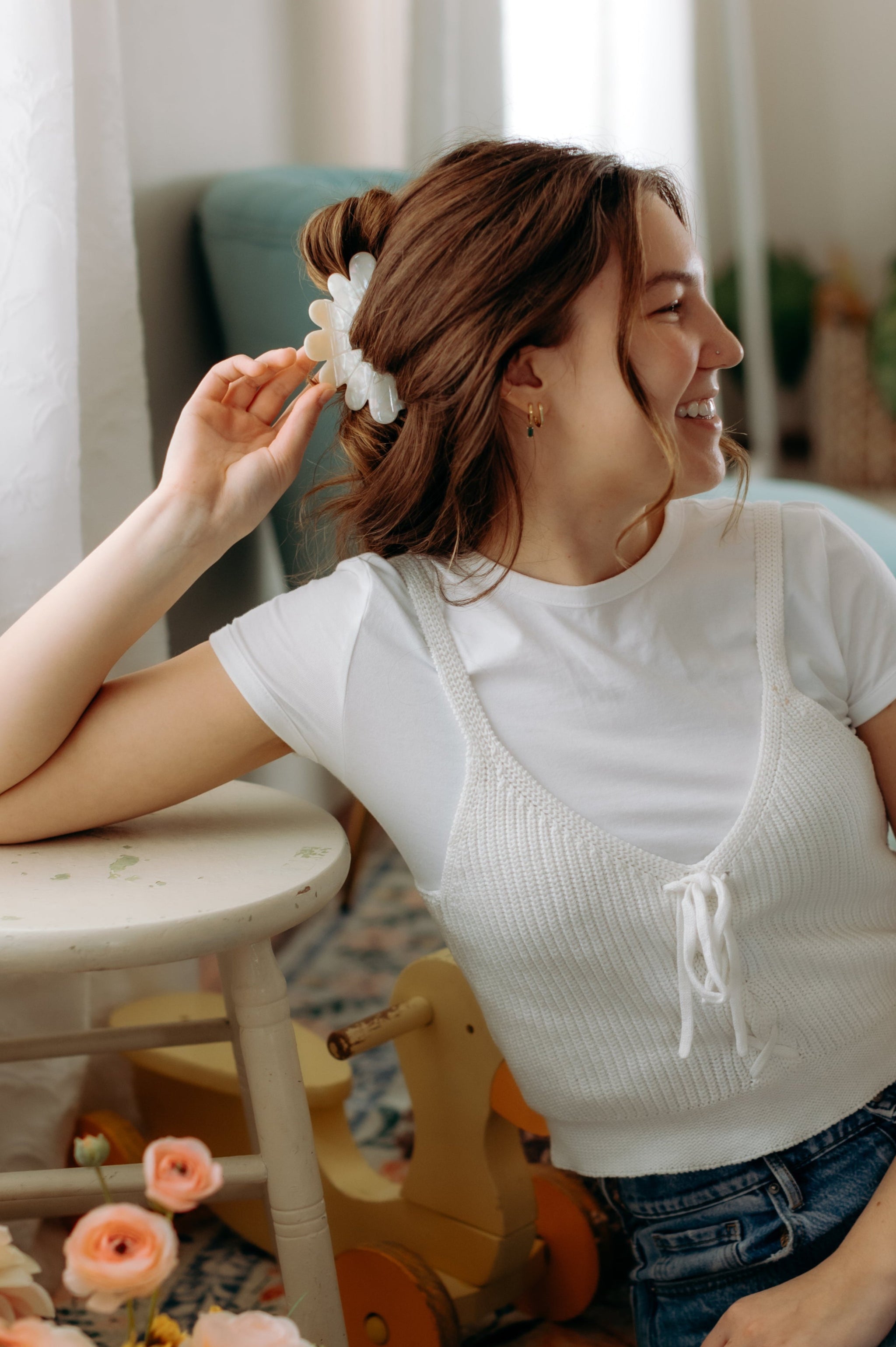 A woman with long hair styled perfectly with the Hold On Tight Lilac Clip, showing both fashion and functionality.