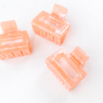 Spring Fling Lilac Clip featuring an opaque square coral clip, 2 inches long, glossy material, metal hinge closure, ideal for keeping hair styled and out of your face.