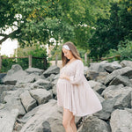 Woman smiling, wearing a Fortitude headband, showcasing its functional, versatile design. The headband is non-slip, sweat-absorbent, and perfect for workouts or daily wear.