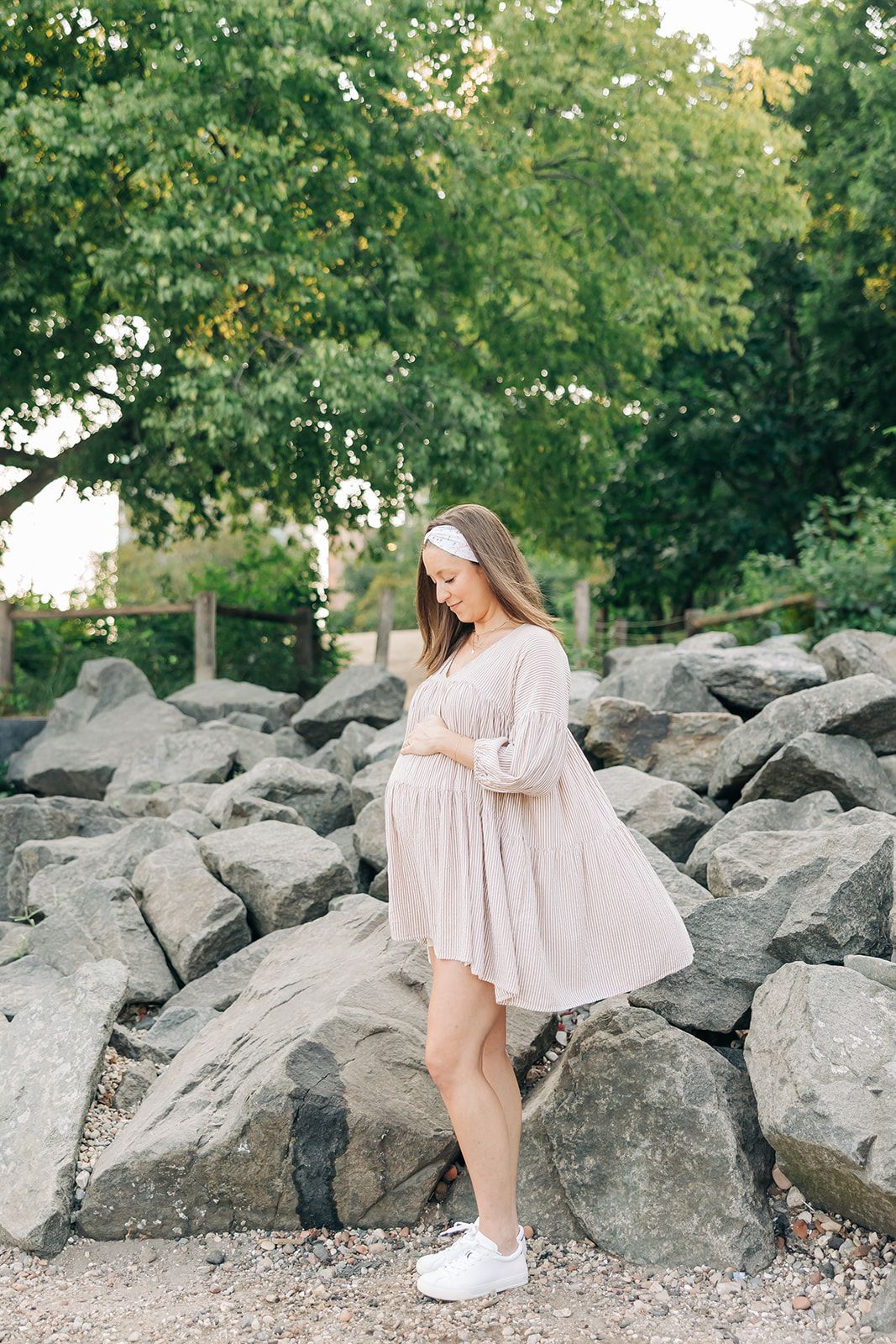 Woman smiling, wearing a Fortitude headband, showcasing its functional, versatile design. The headband is non-slip, sweat-absorbent, and perfect for workouts or daily wear.