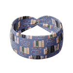 Fully Booked blue headband featuring books on a bookshelf and handwritten scripts of "so many books, so little time" and "It's a good day to read a book", crafted from a buttery-soft, ultra-stretchy poly-knit blend, designed for reliable non-slip comfort.