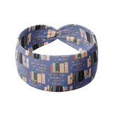 Fully Booked blue headband featuring books on a bookshelf and handwritten scripts of "so many books, so little time" and "It's a good day to read a book", crafted from a buttery-soft, ultra-stretchy poly-knit blend, designed for reliable non-slip comfort.