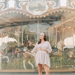 Woman smiling, wearing The Corey headband, a versatile and functional poly-knit blend from The Sarah Wallace Collection, the perfect accessory for easy hairstyles.