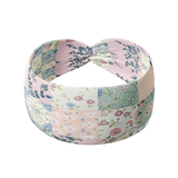 Patchwork headband featuring white, sage, peach and pink patchwork quilt designs, crafted from a buttery-soft, ultra-stretchy poly-knit blend, designed for reliable non-slip comfort.