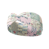 Patchwork headband featuring white, sage, peach and pink patchwork quilt designs, crafted from a buttery-soft, ultra-stretchy poly-knit blend, designed for reliable non-slip comfort.