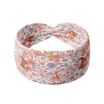 Hunny Bunny white headband featuring pink and brown bunnies with various white, pink, periwinkle and mustard floral pattern, crafted from a buttery-soft, ultra-stretchy poly-knit blend, designed for reliable non-slip comfort.
