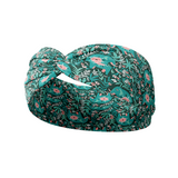 Adult women's dark green headband with teal elephants and greenery, pink tusks and legs and flowers