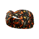 Adult women's black headband with red foxes, orange, green, red and ivory flowers and leaves