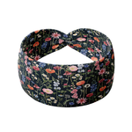 Violet Floral on Black headband with pattern of orange, purple, pink and red flowers with stems, crafted from a buttery-soft, ultra-stretchy poly-knit blend, designed for reliable non-slip comfort.