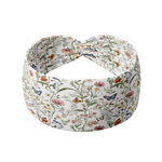 Athena Floral on White headband featuring delicate flowers with gold and blue butterflies, crafted from a buttery-soft, ultra-stretchy poly-knit blend, designed for reliable non-slip comfort.