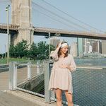 Woman wearing an I Heart NY headband, showcasing its versatile, non-slip design from The Sarah Wallace Collection.