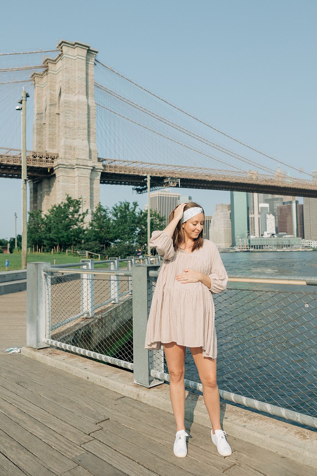 Woman wearing an I Heart NY headband, showcasing its versatile, non-slip design from The Sarah Wallace Collection.
