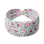 A versatile white headband with a twisted knot and physical therapy themed pattern, designed for confidence and functionality. Features a twist style, sweat-absorbent fabric, and machine washable poly-knit blend.