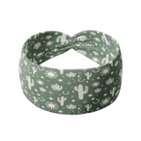 Keeping It Rural headband featuring white cactus designs on a green background. Ultra-stretchy, versatile, sweat-absorbent, and non-slip. Perfect for workouts or daily wear.
