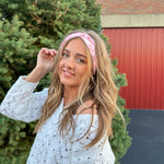 Woman confidently wearing the Torn Between Looking Like a Snack and Eating One headband, showcasing its versatile, non-slip design.