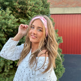 Woman confidently wearing the Torn Between Looking Like a Snack and Eating One headband, showcasing its versatile, non-slip design.