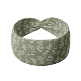 Hazel Floral dark sage headband with white pressed flower design, crafted from a buttery-soft, ultra-stretchy poly-knit blend, the most comfortable hair accessory ever.