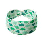 A functional soft green headband with clovers and orange stars, perfect for workouts or play days. One size fits most. Machine washable, sweat absorbent, and non-slip.