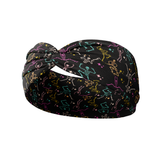Never Better headband featuring colorful skeletons on black, buttery-soft, ultra-stretchy poly-knit blend. Versatile, non-slip, machine washable, perfect for workouts and daily wear.
