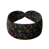 Never Better headband featuring colorful skeletons on black, buttery-soft, ultra-stretchy poly-knit blend. Versatile, non-slip, machine washable, perfect for workouts and daily wear.