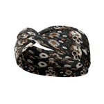Quinn Floral on Black headband featuring skulls and flowers, ultra-stretchy poly-knit blend, sweat absorbent, non-slip, versatile twist style.
