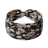 Adult women's black headband with allover artisticly painted human skulls, white peony flowers, other smaller white flowers and butterflies