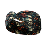 Adult women's black headband with various red, white, blue and green flowers and greenery with shadowed skulls