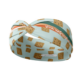 Adult women's light blue headband with a wavy rainbow of teal, orange and coral and unfrosted pop-tarts with the words "you unfrosted pop-tart" in cursive