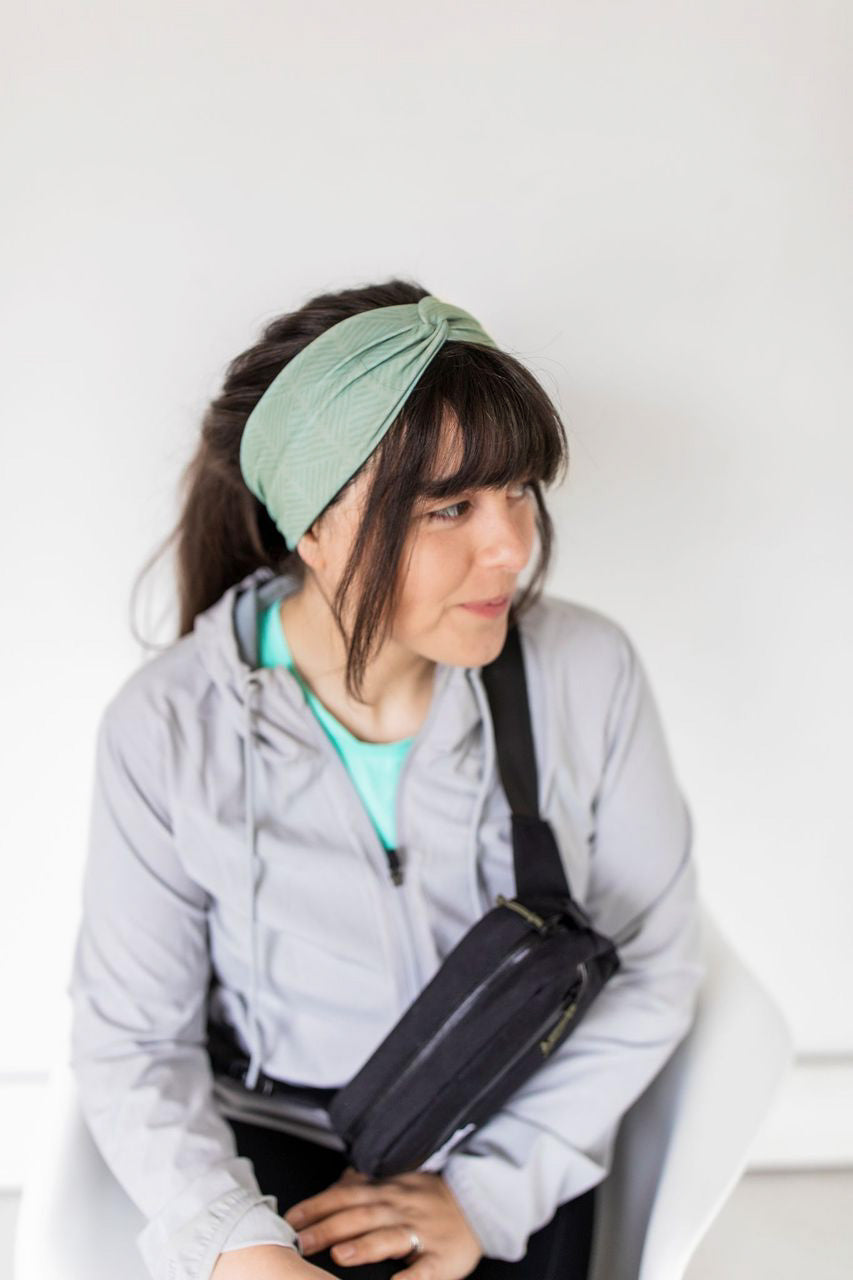 Adult women's sage headband with dark sage tribal triangles made of lines going different directions