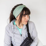 Adult women's sage headband with dark sage tribal triangles made of lines going different directions