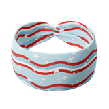 A patriotic headband featuring red and white wavy stripes, stars, and a blue background. Versatile 3-in-1 twist style, sweat-absorbent, and non-slip for workouts or play. Designed for confidence and comfort.