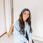 Adult women’s black headband with white paisley bandana print.