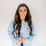 Adult women’s black headband with white paisley bandana print.