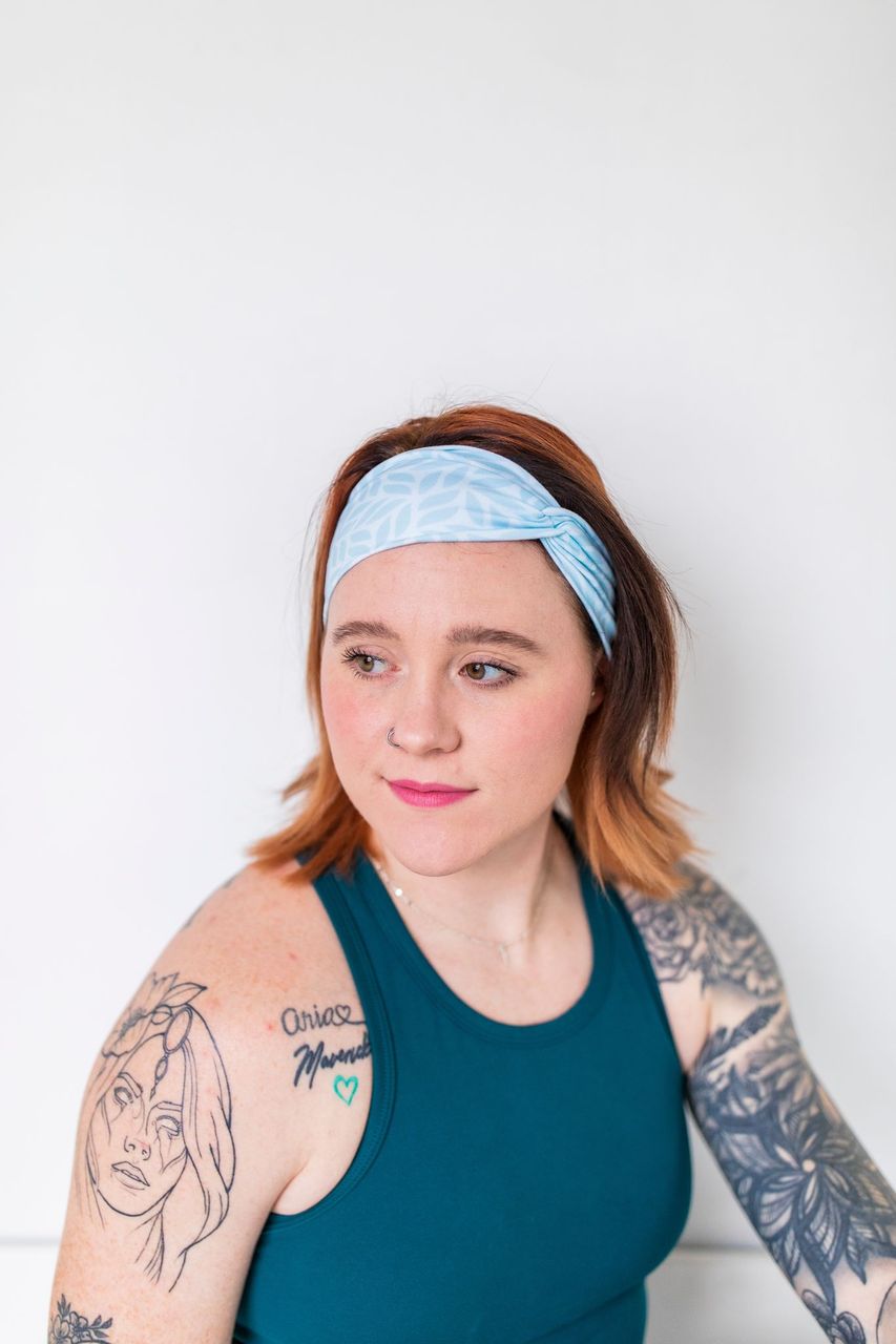 Adult women's light blue headband with blue leaves