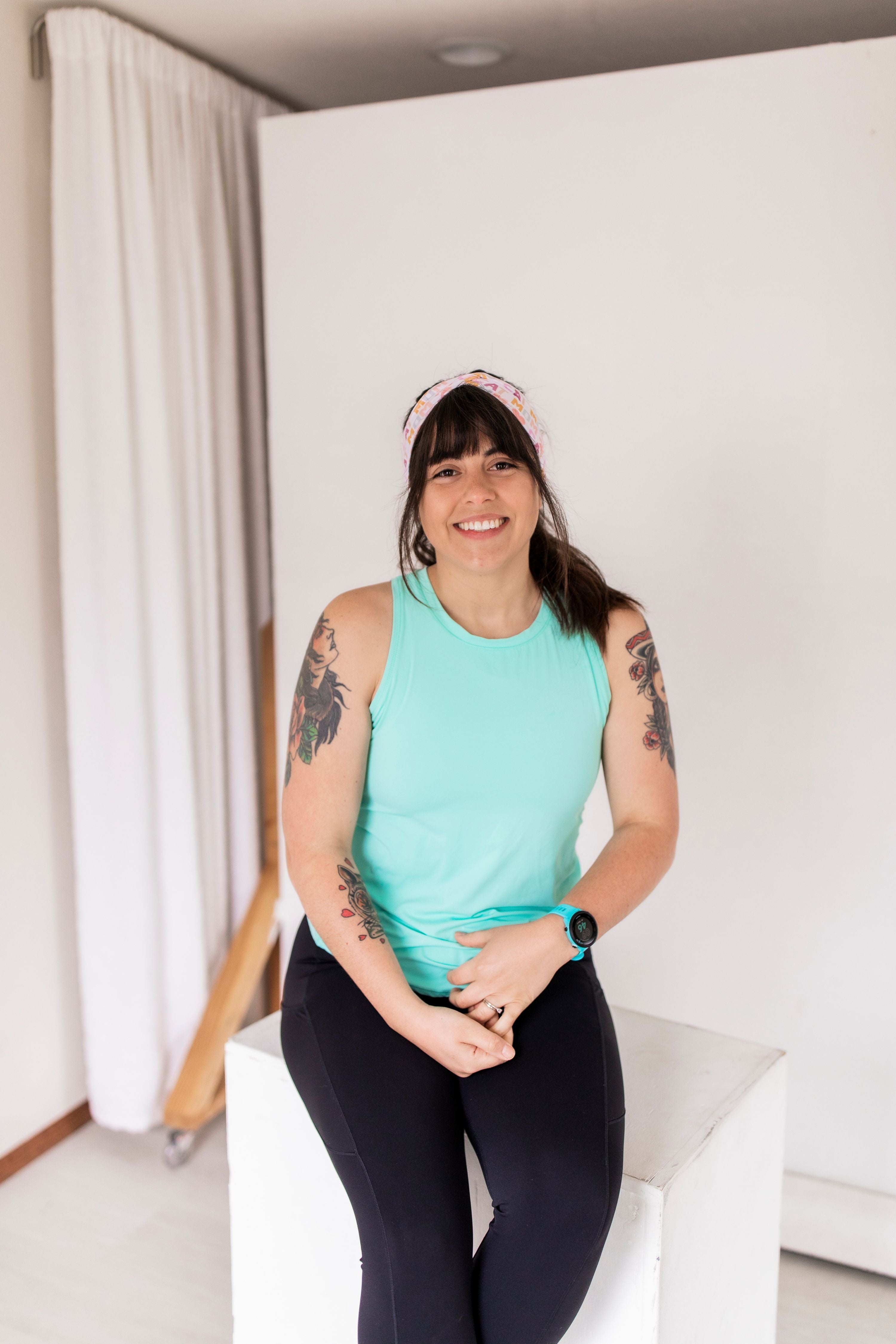 Adult women's white headband with orange, slate, tan, blush and plum pawprints, hearts and words they say "cat mom"