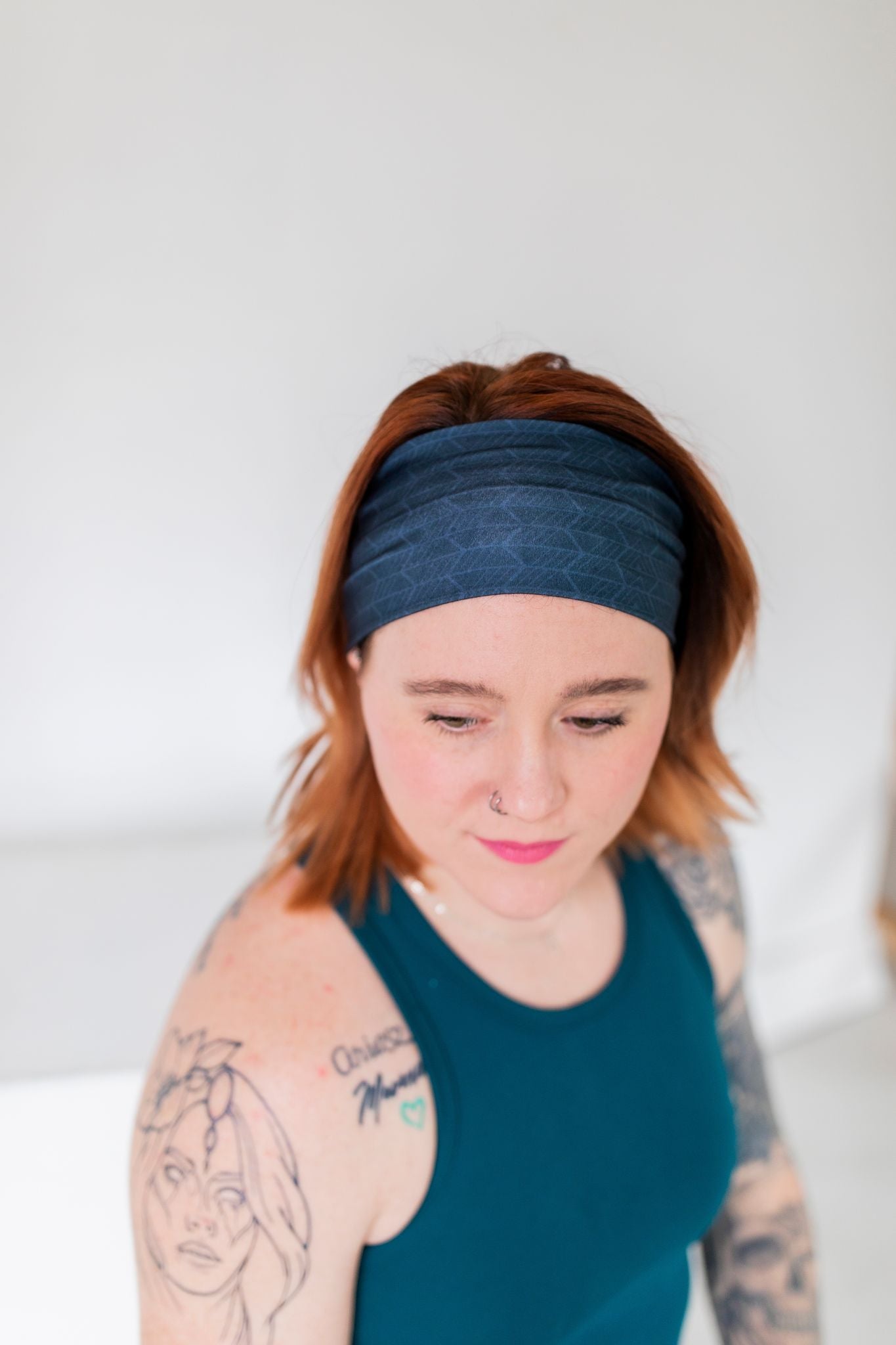 Adult women's onyx headband with off-black lines tribal lines and angles