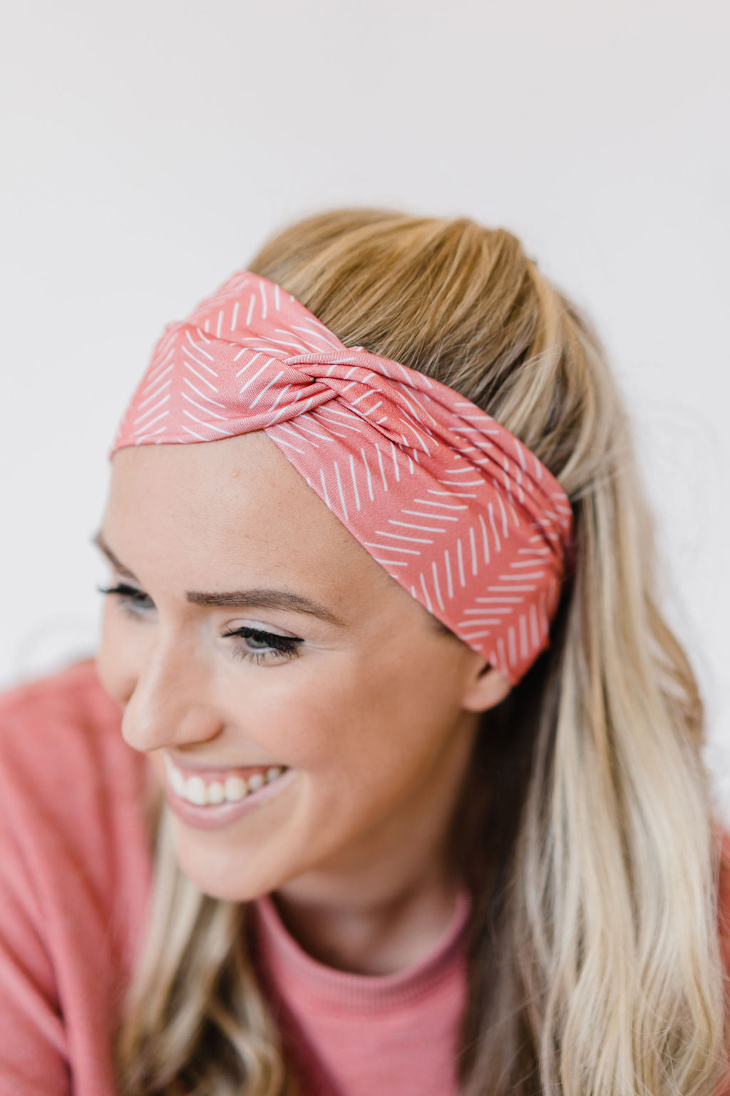Adult women's coral headband with white slanted lines