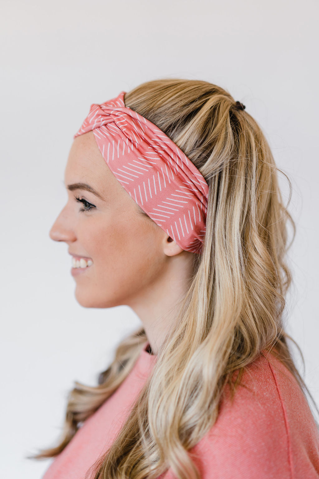 Adult women's coral headband with white slanted lines