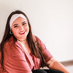 Adult women's ivory headband with allover salmon colored tribal dashes in half circle patterns