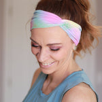 Adult women's tie dye headband with pink, mint, purple and yellow colors with allover mermaid scale print