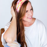 Adult women's white headband with bright red and yellow pixel print