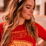 Adult women's white headband with bright red and yellow pixel print