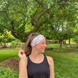 Adult women's ivory headband with soft pink, coral and green watercolor floral print