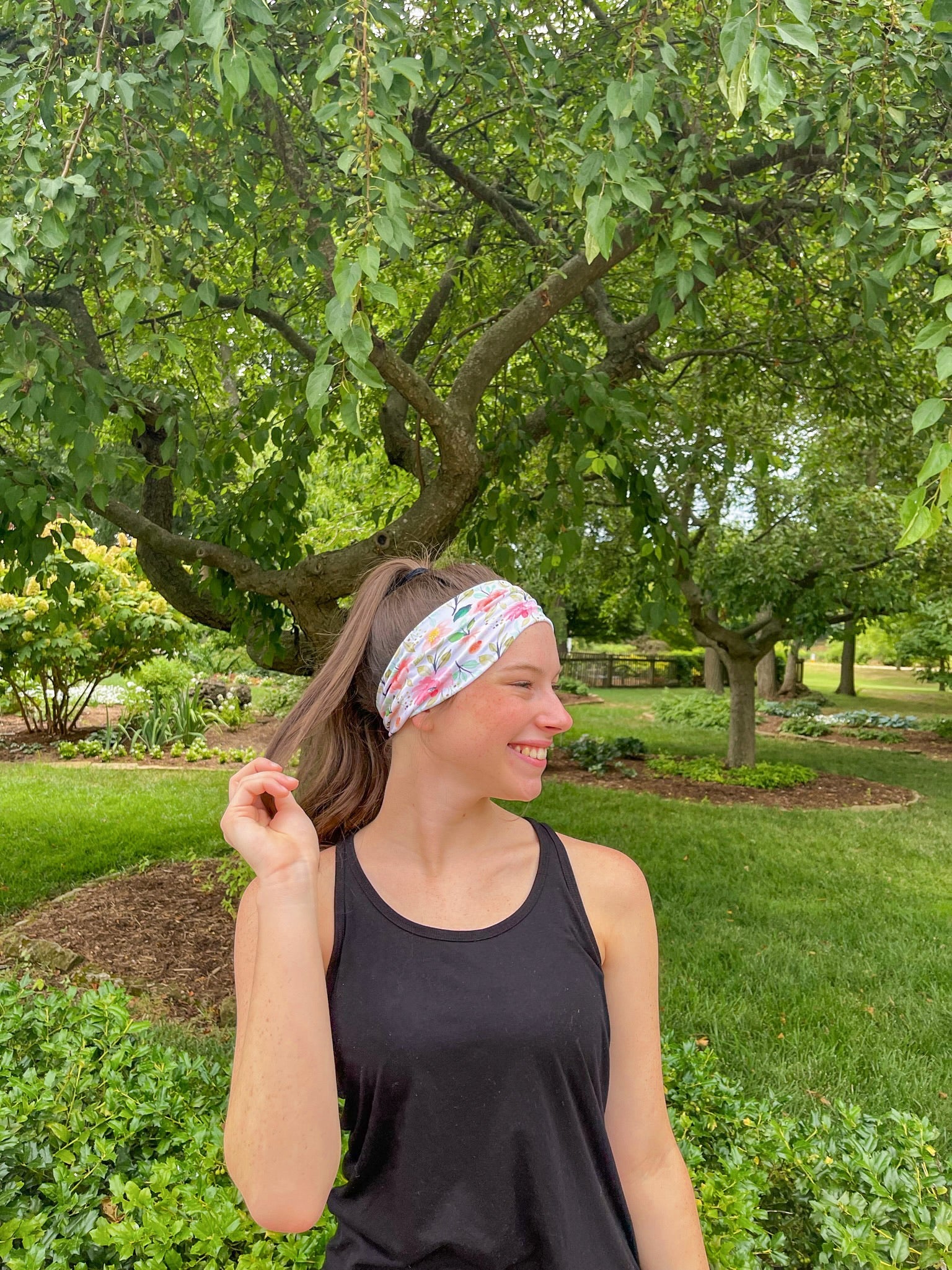 Adult women's ivory headband with soft pink, coral and green watercolor floral print